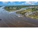 Picturesque aerial view showcasing waterfront homes and a marina at 4247 Villas Dr. # 406, Little River, SC 29566