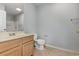 Clean bathroom featuring a vanity with storage and a combined shower and toilet area at 4247 Villas Dr. # 406, Little River, SC 29566
