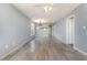 Open-concept room with hard surface floors and neutral paint at 4247 Villas Dr. # 406, Little River, SC 29566