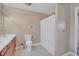 Bright bathroom featuring a vanity with a sink, toilet, and a shower/tub with a white shower curtain at 4293 Parkway Ln. # 34, Little River, SC 29566