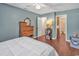 Comfortable bedroom featuring hardwood floors with access to the open closet and full bathroom at 4293 Parkway Ln. # 34, Little River, SC 29566