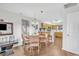 Dining area with wooden table and seating for four and a view of the kitchen at 4293 Parkway Ln. # 34, Little River, SC 29566