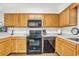 Functional kitchen featuring light wood cabinets, laminate countertops and modern appliances at 4293 Parkway Ln. # 34, Little River, SC 29566