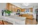 Well-equipped kitchen featuring light wood cabinets, laminate countertops, and a breakfast bar at 4293 Parkway Ln. # 34, Little River, SC 29566