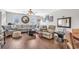Spacious living room features a large sectional sofa, wood floors and many windows at 4293 Parkway Ln. # 34, Little River, SC 29566