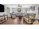 Inviting living room featuring a large sofa, wood floors, and plentiful natural light at 4293 Parkway Ln. # 34, Little River, SC 29566