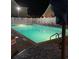 Night view of a shimmering community pool area, well lit and inviting at 4293 Parkway Ln. # 34, Little River, SC 29566