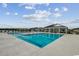 Community pool with ample seating and a covered clubhouse, perfect for summer fun at 435 Kapalua Loop, Little River, SC 29566