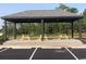 Outdoor picnic shelter with wooden tables and benches, perfect for community gatherings and outdoor dining at 435 Kapalua Loop, Little River, SC 29566