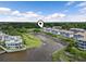 Aerial view of waterfront condos and docks surrounded by lush green marshland and vegetation at 4405 Eastport Blvd. # D-8, Little River, SC 29566