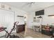 Cozy bedroom with light wood floors, open door, closet, media center and exercise equipment at 4405 Eastport Blvd. # D-8, Little River, SC 29566
