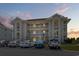 Condominium exterior showcasing multiple balconies and parking at 4405 Eastport Blvd. # D-8, Little River, SC 29566