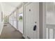 Exterior view of a condo hallway with a light colored door at 4405 Eastport Blvd. # D-8, Little River, SC 29566