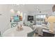 Relaxing living room featuring a decorative aquarium, comfortable seating, and a sliding door to the outside deck at 4405 Eastport Blvd. # D-8, Little River, SC 29566