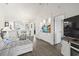 Spacious living room featuring hardwood floors, open to kitchen, dining area and custom aquarium, and a deck at 4405 Eastport Blvd. # D-8, Little River, SC 29566