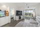 Comfortable living room features a large slider with access to a balcony and a view to the bedroom at 4405 Eastport Blvd. # D-8, Little River, SC 29566