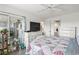 Bright main bedroom with a cozy quilt, slider to screened in porch, and ample natural light at 4405 Eastport Blvd. # D-8, Little River, SC 29566