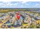 Breathtaking aerial view showcasing the community's layout, landscaping, and proximity to the ocean at 4861 Luster Leaf Circle # 204, Myrtle Beach, SC 29577