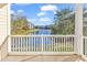 Beautiful balcony view with a fountain, landscaping, and a glimpse of neighboring buildings at 4861 Luster Leaf Circle # 204, Myrtle Beach, SC 29577