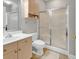 Functional bathroom with a walk-in shower, vanity with sink, toilet, and storage cabinet, combining comfort and convenience at 4861 Luster Leaf Circle # 204, Myrtle Beach, SC 29577