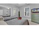 Cozy bedroom with two beds, a sliding mirror closet, and a functional dresser with a television for relaxation at 4861 Luster Leaf Circle # 204, Myrtle Beach, SC 29577