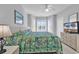 Serene bedroom with bay windows, neutral decor, and a comfortable bed, creating a relaxing retreat at 4861 Luster Leaf Circle # 204, Myrtle Beach, SC 29577