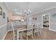 Inviting dining area with a large table and chairs, adjacent to a kitchen with bar seating, creating a cozy ambiance at 4861 Luster Leaf Circle # 204, Myrtle Beach, SC 29577