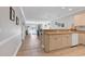 Open floor plan showcasing a kitchen with wooden cabinets flowing into a living area with a scenic outdoor view at 4861 Luster Leaf Circle # 204, Myrtle Beach, SC 29577