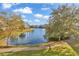 Scenic lake view from a condo building with a fountain and lush landscaping in the background at 4861 Luster Leaf Circle # 204, Myrtle Beach, SC 29577