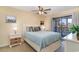 Comfortable bedroom with a queen-size bed and access to the back porch at 501 Maison Dr. # E20, Myrtle Beach, SC 29572