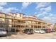 Exterior view of building featuring multiple stories, balconies, and convenient parking at 501 Maison Dr. # E20, Myrtle Beach, SC 29572