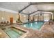 Indoor pool area with a hot tub, seating and natural light, perfect for year-round enjoyment at 501 Maison Dr. # E20, Myrtle Beach, SC 29572