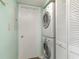 Convenient laundry area featuring a stacked washer and dryer unit and a utility closet at 501 Maison Dr. # E20, Myrtle Beach, SC 29572