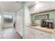 Convenient wet bar featuring white cabinets, plenty of counter space, and modern appliances at 501 Maison Dr. # E20, Myrtle Beach, SC 29572