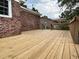 Wooden back deck with brick house, an outdoor space perfect for entertaining at 506 Byrnes Circle, Johnsonville, SC 29555