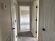 Hallway with multiple doors and carpeted flooring at 506 Byrnes Circle, Johnsonville, SC 29555