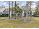 Exterior view of a community with a shared backyard and many trees at 4350 Spa Dr. # 506, Little River, SC 29566
