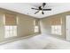 A cozy bedroom featuring a ceiling fan and bright windows that stream soft sunlight into the room at 4350 Spa Dr. # 506, Little River, SC 29566