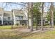 Charming condos featuring screened porches and balconies surrounded by mature trees and greenery at 4350 Spa Dr. # 506, Little River, SC 29566
