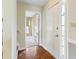 The foyer has a wood floor with a view of a room with stairs at 4350 Spa Dr. # 506, Little River, SC 29566