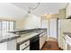 Kitchen with stone countertops and updated appliances, ideal for cooking and entertaining in a modern style at 4350 Spa Dr. # 506, Little River, SC 29566
