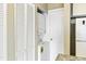 Handy laundry closet with stacked washer and dryer for added convenience at 4350 Spa Dr. # 506, Little River, SC 29566