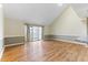 Bright living room with laminate floors, neutral paint, and sliding glass doors at 4350 Spa Dr. # 506, Little River, SC 29566