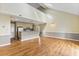 Spacious open-concept room featuring laminate floors, a kitchen area, and high ceilings at 4350 Spa Dr. # 506, Little River, SC 29566