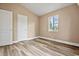 Bedroom showcasing a closet, a window, neutral walls, and modern flooring at 512 W Baptist St., Marion, SC 29571