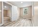 Bedroom featuring neutral walls, wood-look floors, and natural light from window at 512 W Baptist St., Marion, SC 29571