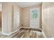 Bright laundry room with wood-look floors and access to the backyard at 512 W Baptist St., Marion, SC 29571