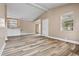 Bright living room featuring wood-look floors and built-in storage with marble countertops at 512 W Baptist St., Marion, SC 29571