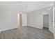 Spacious bedroom has modern ceiling fan, neutral walls, and doorway to the closet and bathroom at 54 Freedom Way, Myrtle Beach, SC 29577