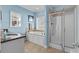 Bright bathroom with a tiled shower, soaking tub, and granite vanity at 6001 - 8022 S Kings Hwy., Myrtle Beach, SC 29575